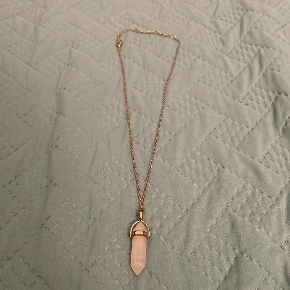 Gold necklace with pink stone
